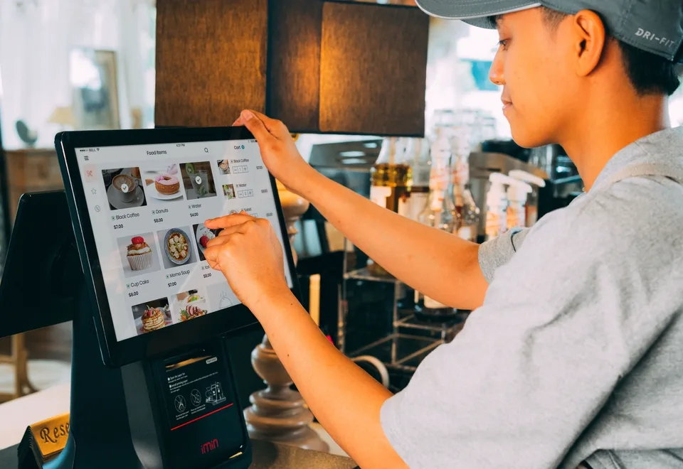 A seller using a counter register